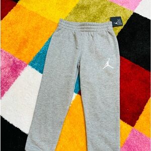 Jordan:Nike joggers. This was a 2 piece set but only the top fit my son.